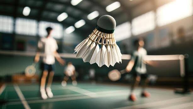 Badminton player smashing with a YONEX racket